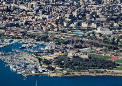 The Fort Carré, Antibes' olympic-size swimming pool and the red-ish train station on the left