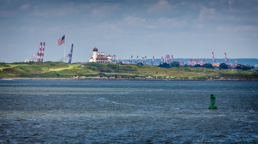 A strange golf course on Jersey shores, between oil refineries and port installations