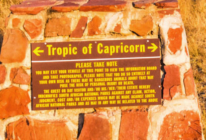 Close-up of the Tropic of Capricorn sign - Die at your own risk